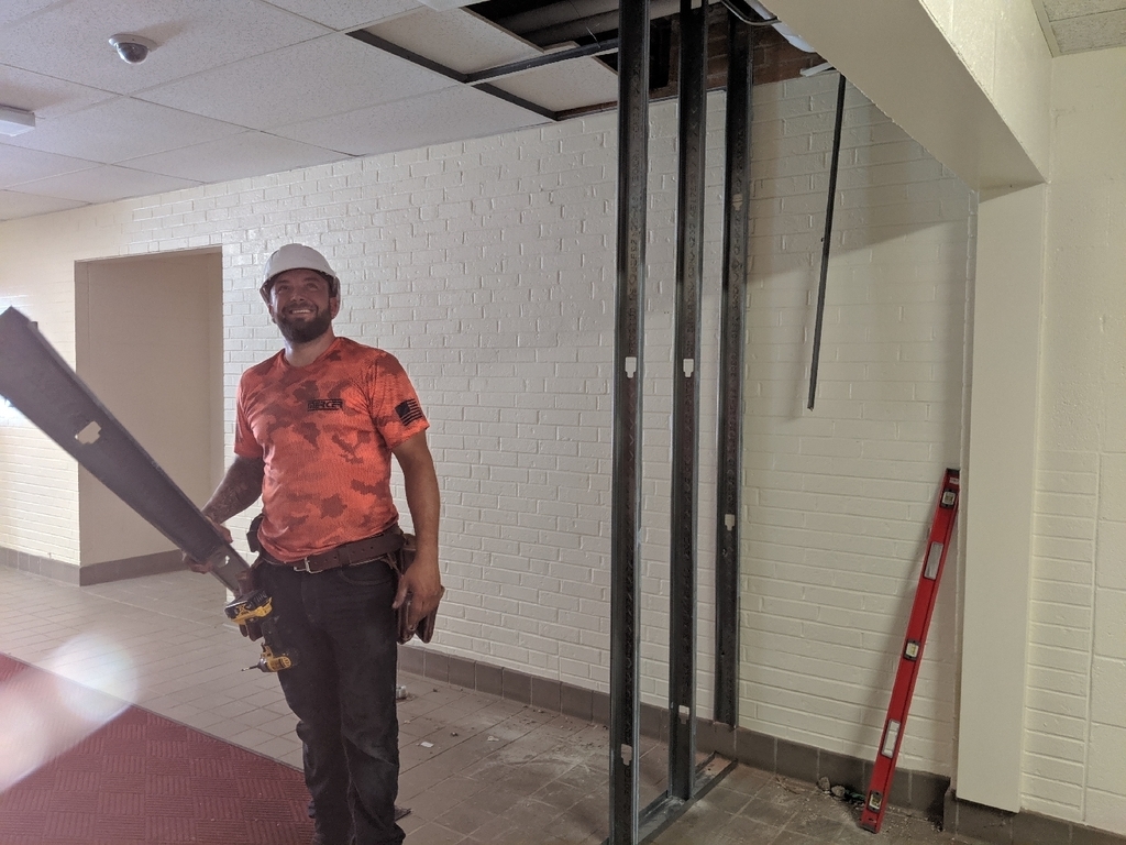 construction worker building Townsend's new vestibule.