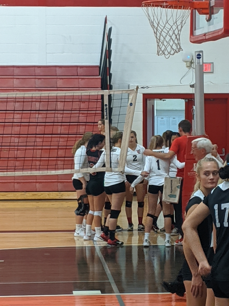 volleyball in huddle